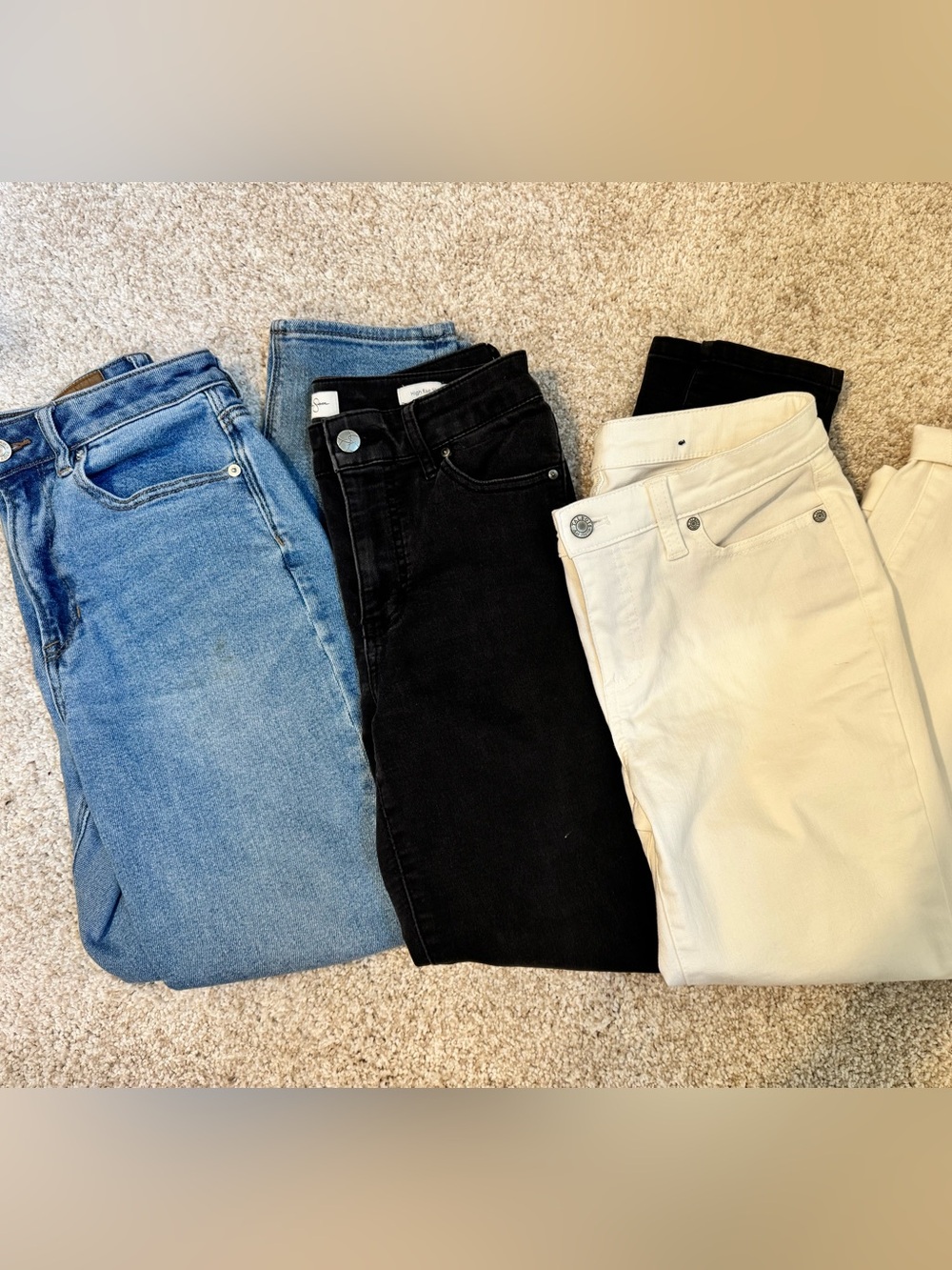 Bundle of three size 4 jeans (white, black, and blue)